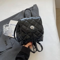 Chic black quilted backpack in shiny faux leather with silver metal twist lock closure - Black