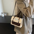 Chic cream and brown crossbody bag with silver butterfly charm and top handle - White & Coffee