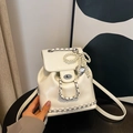 Creamy white small bucket backpack with silver metal chains and pearl bow pendant - With Pendant / Off White
