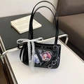 Black patent leather tote bag with heart-shaped window and white lace ribbon details - Black