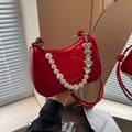 Red patent leather crescent underarm bag with pearl chain and silver heart charm - Burgundy