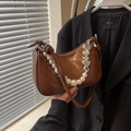 Brown glossy faux leather baguette bag with pearl and heart charms and knotted strap - Coffee