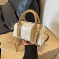 Mini Boston Handtasche in Creme und Braun aus Leder mit goldenen Beschlägen und Gurt - Cremeweiß