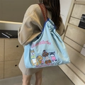Borsa tote in tela azzurra con ricami di cani e tracolla in tessuto jacquard - Blu