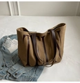 Detail of khaki tote bag with TLYN lettering and dark brown leather straps - Khaki