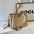 Minimalist beige PU leather tote bag with brown straps in a stylish indoor setting - Apricot