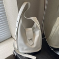 White crescent Hobo bag featuring a metallic silver bow detail and adjustable strap - Off-white