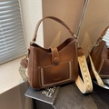 Brown leather bucket bag with stylish embroidered wide strap and front pocket - Coffee