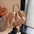 Ruched bucket handbag in beige pink with drawstring closure and crossbody strap - Khaki