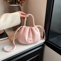 Pink pleated bucket bag with textured PU leather finish and a square magnetic buckle - Pink