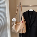Beige canvas tote bag with colorful heart patches and cloud charm on a metal hanger - Khaki With Pendant