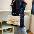 Quilted white crossbody bag with gold SK metal turn-lock and embossed texture - White