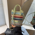 Bohemian colorful striped woven straw bag with green leather handles and shoulder strap - Green