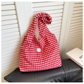 Detailed close-up of red and white checkered canvas tote bag with good patch on white shutters - Small Grid Red