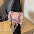 Pink quilted crossbody bag with rhinestone lock and silver chain strap for women - Pink