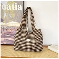 Brown and white checkered canvas tote bag with a white leather good label - Brown