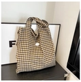 Brown and beige checkerboard canvas tote bag with a white oval good label tag - Brown