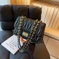 Quilted black leather shoulder bag with gold chain strap and metallic clasp closure - Black