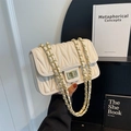 Chic beige quilted shoulder bag with V-shaped stitching and golden chain strap - Off White