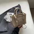 Beige lychee pattern leather bucket bag with top handles and gold hardware - No Pendant / Sand