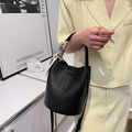 Black lychee leather bucket bag with silk scarf handle and slim shoulder strap - Black
