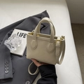 Chic beige lychee leather tote bag with dual round handles and golden hardware details - No Pendant / Off White