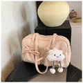 Beige retro bowling handbag with bow detail and cute cloud charm on a black stool - With Pendant / Pearlescent Pink