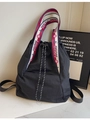 Large black nylon tote bag with drawstring closure and striped straps for women - Black