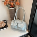Light blue patent leather Boston bag with side pockets and pearl bow charm - Blue