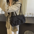 Minimalist black pleated shoulder bag with adjustable drawstrings and zip closure - Black