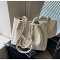 Creamy white leather tote bag with braided handle and decorative pearl chain detail - Off-white