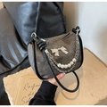 Detail of grey denim shoulder bag with pearl strands and silver metallic bow accents - Dark Brown