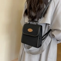 Retro black faux suede mini backpack with Nice Fashion patch shown on shoulder - Black
