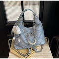 Light blue denim tote bag with silver bow, pearl chain and cloud charm in variant blue - With Charm / Blue