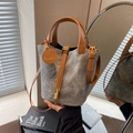 Grey denim and brown leather bucket bag with gold padlock and smiley face charm - Dark Brown