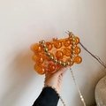 Orange translucent acrylic bubble handbag with golden ball handle and metal chain strap - Orange