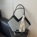 Gray canvas tote bag with black leather handles and stylish V-cut top design - Blue