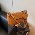Brown vintage flap shoulder bag with silver bow decor and heart pendant charm - Brown
