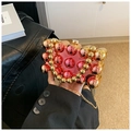 Pink acrylic evening clutch detail showing bubble texture and gold metal chain strap - Gold Pink