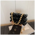 Black acrylic evening bag with glossy sphere design and gold chain strap detail - Black