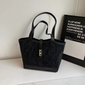 Minimalist black tote bag with pleated texture and golden metal buckle for daily commute - Black