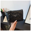 Elegant black quilted crossbody bag with silver chain strap and triangular metal plaque - Black