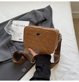 Brown quilted camera bag with adjustable wide strap and triangular metal plaque logo - Orange
