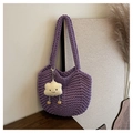 Close-up of lavender purple woven knit tote bag with a cute cloud plush charm - Purple