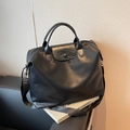 Black large capacity travel bag in smooth PU leather with ruffled flap detail - Black