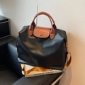 Black large travel tote bag with brown leather handles and orange nylon strap - Black and Brown