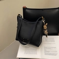 Black pebbled leather bucket bag with gold hardware and leopard rabbit charm - Black