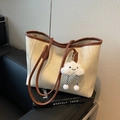 Cream tote bag with brown trim and cute cloud plush charm on a fashion book - Off-white With Pendant
