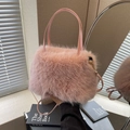 Chic pink faux fur crossbody bag with top handle and matching slim shoulder strap - Pink