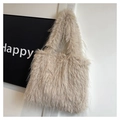 Close-up of fluffy faux rabbit fur texture on a beige tote bag for autumn and winter - Khaki